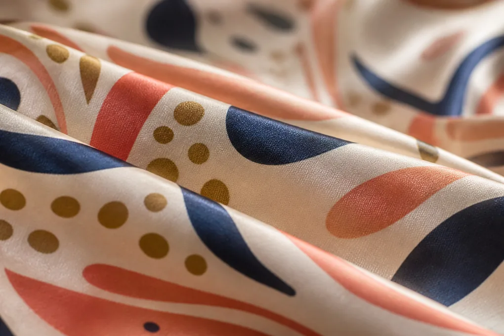 Close view of printed silk showing motif scale and natural surface sheen